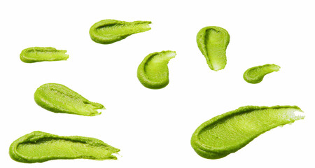 Splashes and stains wasabi sauce isolated on white background.