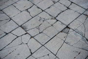 broken square shaped pattern footpath concrete