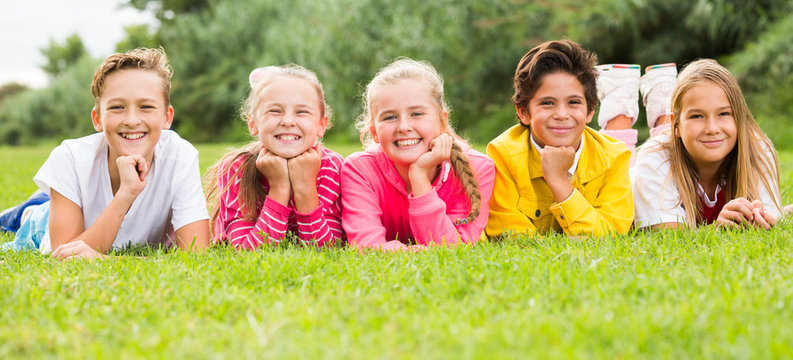 Portrait of children who are posing lying