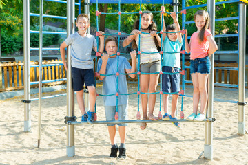 Fototapeta na wymiar Happy children playing at playground