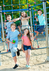 Fototapeta na wymiar Happy children playing at playground