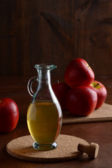 closeup apple cider vinegar on cork mat