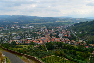 Fototapeta na wymiar Panoramic view of small italian town from the hill