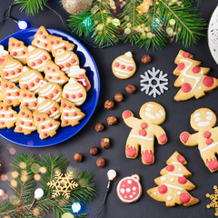Tasty Christmas cookies, Christmas tree, decorations on black background. Christmas cooking concept