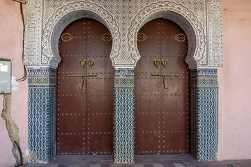 Traditional Moroccan style design of an ancient wooden entry door. In the old Medina. Typical, old,...