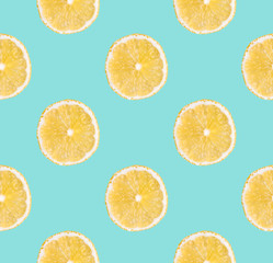 Background of fresh yellow lemon slices. Seamless pattern. Close up. Studio photography.