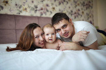 Funny happy family with one baby in real room