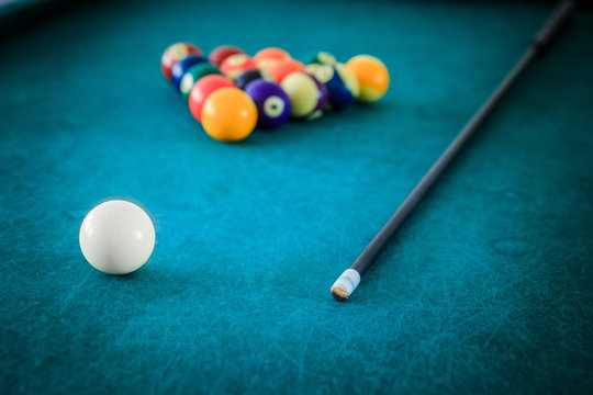 Billiard in a bar, queue and balls on the table, quitting time