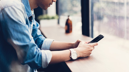 Man using smartphone, During leisure time. The concept of using the phone is essential in everyday life.