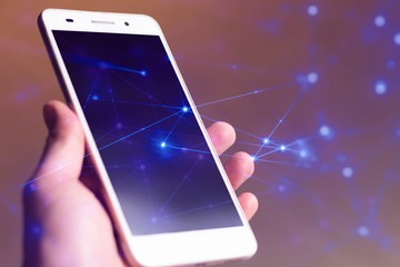 hologram and man pick mobile phone with blue background in business network telecom concept