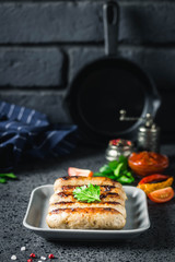 Grilled kebabs on dark background. Selective focus, space for text.