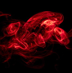 Red smoke on black background