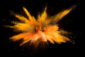 Explosion of colored powder on black background
