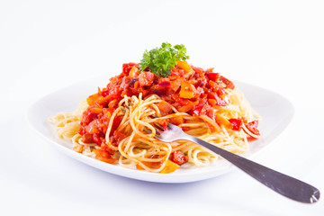 Spaghetti with sauce decorated with parsley eaten with a fork on a white background