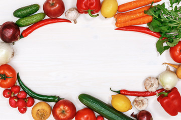 Vegetables and fruits on a white wooden table. Top view. Copy space.