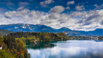 Fototapeta na wymiar Aerial view of Bled lake near the Bled town in Slovenia. National park Triglav, part of Alps mountains called Julian Alps.