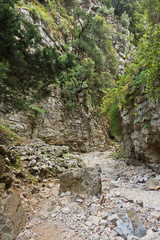 Trekking on a winding path through Imbros gorge near Chora Sfakion, island of Crete, Greece