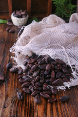 Chocolate beans on wooden table