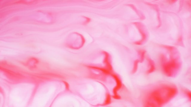Colored paint beautiful spread in liquid, realtime shot