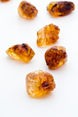 Brown caramelized sugar on white background.