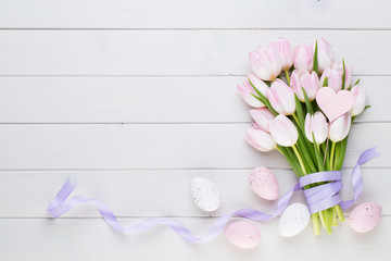 Pink pastel color tulip on the white background. Easter background.