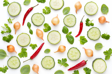 Vegetable and spices isolated on white background, top view. Wallpaper abstract composition of vegetables.