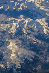 Fototapeta premium Swiss Alpes with snowy mountain tops aerial