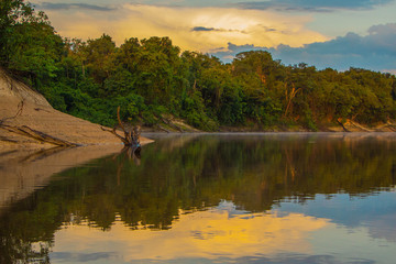 river bank jungle clouds sunset