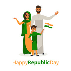 Happy indian family in traditional clothing celebrating the Republic Day of India. Smiling Father, mother and son holding the flag of India.
