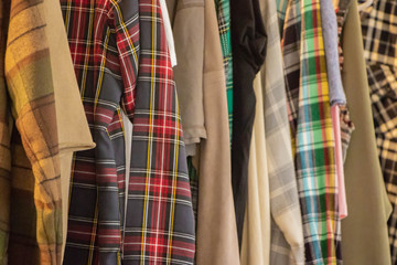 plaid shirt layers hanging different colors