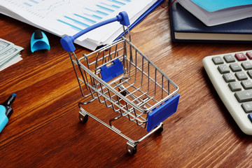 Retail marketing. Shopping cart on an office desk.
