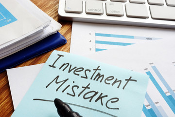 Investment Mistake written on a financial documents.