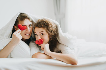 Happy couple in love with red heart