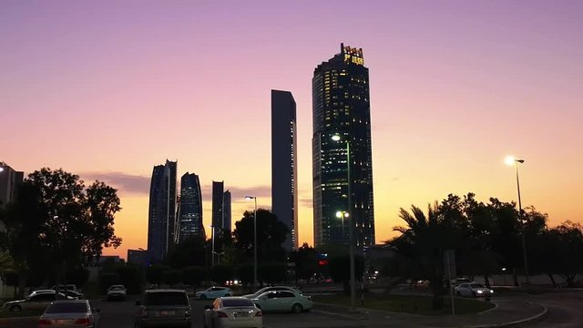 Abu Dhabi city streets, beautiful view of famous Etihad towers at sunset