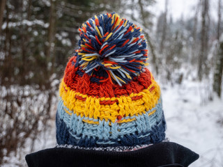 Image of woman wearing bobble hat close up
