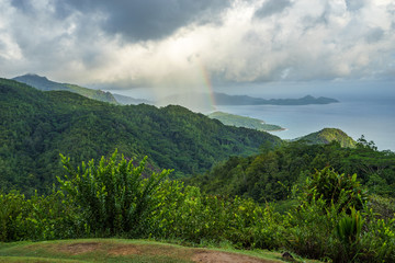 rainbow and rain over the jungle and mountains of mahé, seychelles 4