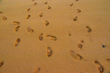 Beach sand footprint ocean coast sea azure wave with bubble. Human steps on shore