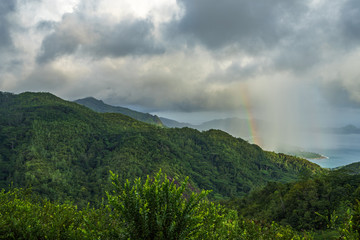 rainbow and rain over the jungle and mountains of mahé, seychelles 12