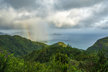 rainbow and rain over the jungle and mountains of mahé, seychelles 13