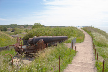 The road runs along the shore of the historic Suomenlinna fortress island near the old Russian...