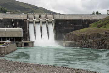 The Clyde hydroelectric power dam spilling large amounts of excess water. Clyde, Otago, New Zealand.