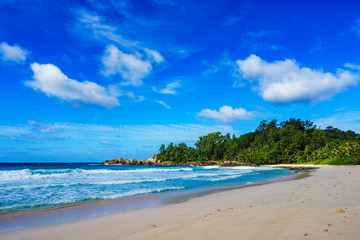 Fototapeta na wymiar Beautiful tropical beach,palms,white sand,granite rocks,seychelles 2
