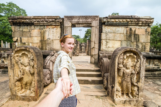 The girl leads to the ruins (Follow Me). Sri Lanka, Polonnaruwa, Royal Palace of King Parakramabahu