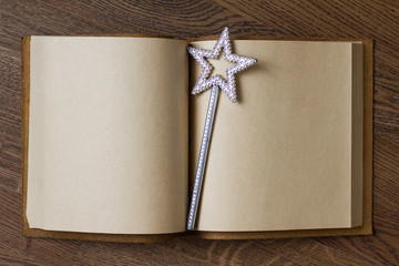 book with magic wand