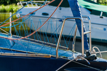 The rigging block with swivel and yellow rope. Part of the rigging of the yacht