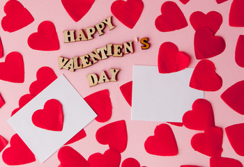 Many hearts with an inscription Happy Valentine's Day on a pink background.. Background for a greeting card for Saint Valentine's Festive concept for Valentine's day, Mother's day or birthday