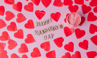 Wedding ring and many hearts with an inscription Happy Valentine's Day on a pink background..Festive concept for Valentine's day, Mother's day or birthday