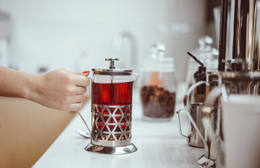 fresh berry tea in French press on the table