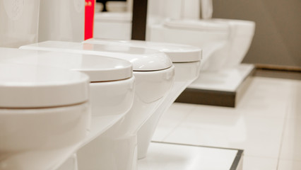 Fototapeta na wymiar blurred image of toilet bowls aisle in a hardware store