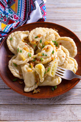 Dumplings, filled with cabbage. Varenyky, vareniki, pierogi, pyrohy - dumplings with filling